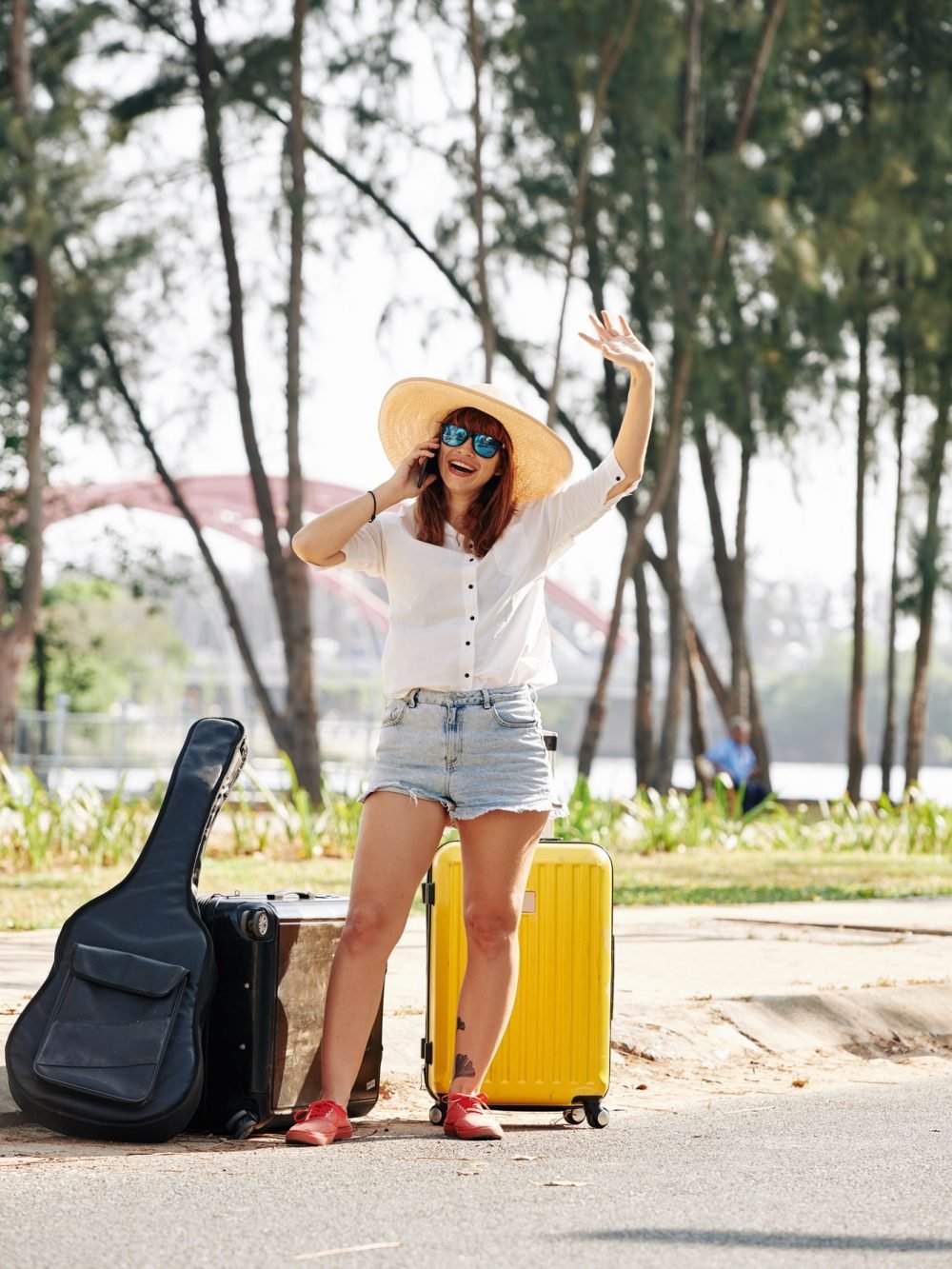 female-traveler-trying-to-chatch-car.jpg